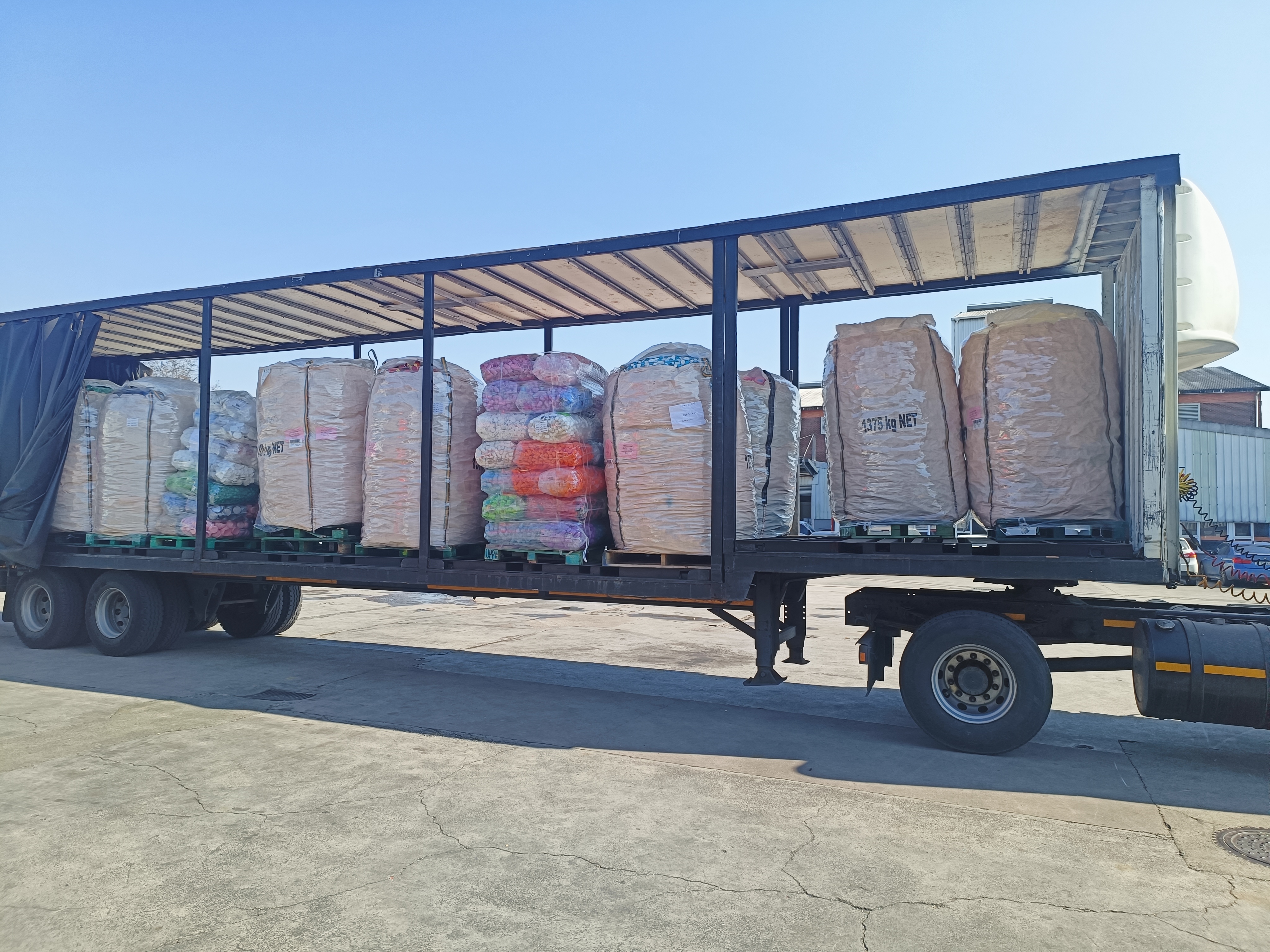 Truck loaded with baled material for dispatch