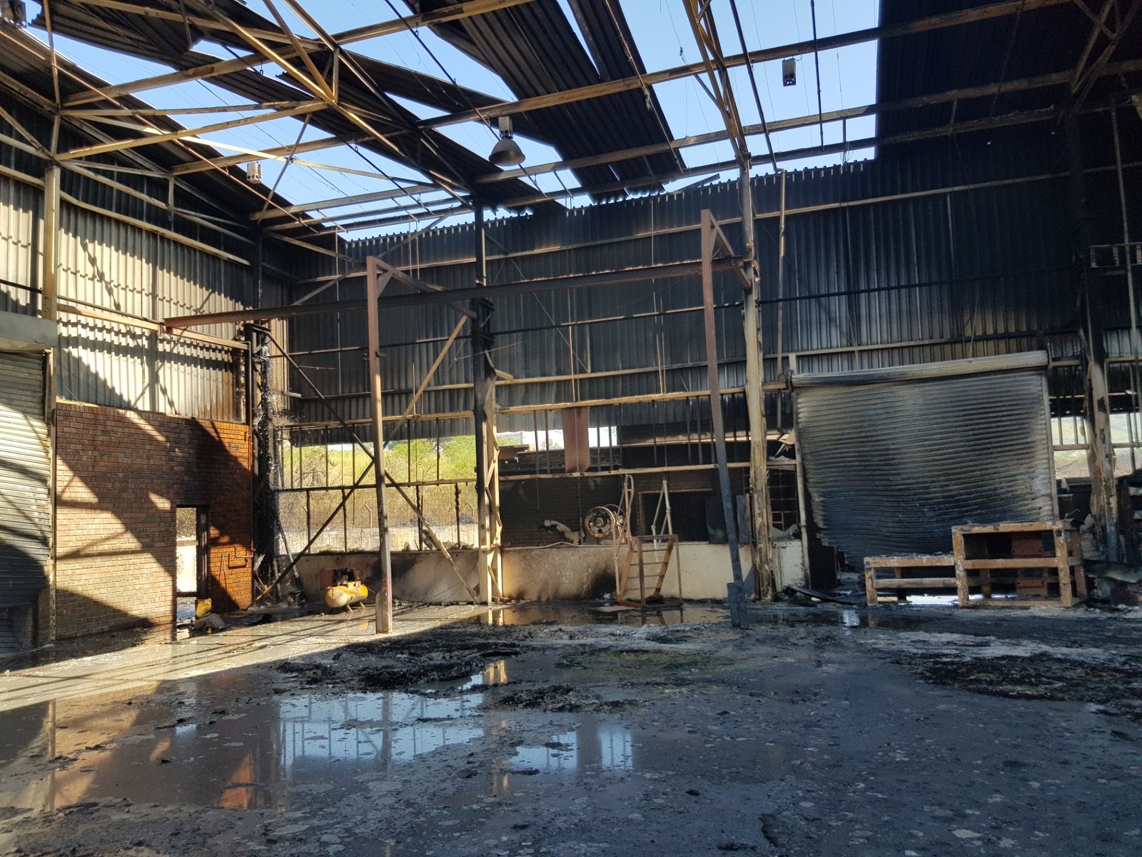 Inside the main warehouse at 25 Brown Street after the fire