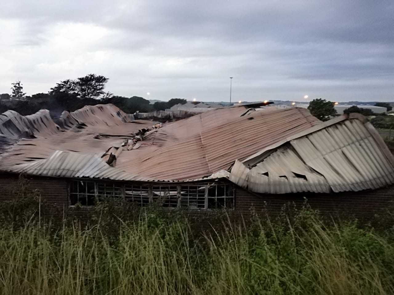 Collapsed facility roof structure